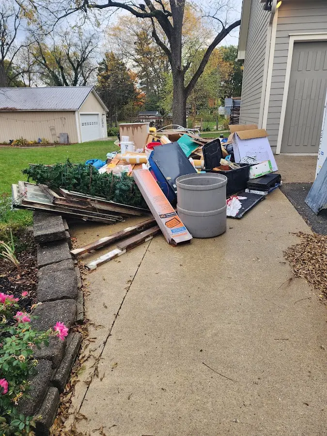 Dumpster being loaded with debris for Residential Dumpster Rental in Rockport